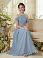 Dusty Blue girls' off-the-shoulder chiffon junior bridesmaid dress, seated lifestyle view