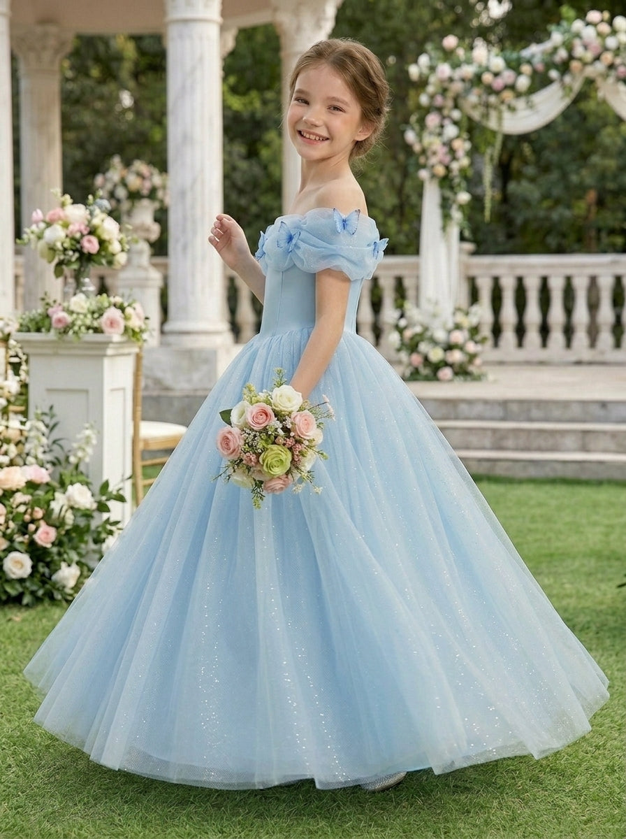 Girl wearing a light blue off-shoulder bow flower girl dress with a wedding bouquet