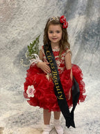 Girl in red beaded ruffle cupcake pageant dress with winner sash