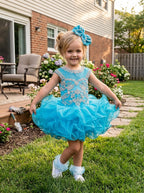 Girls turquoise beaded ruffle cupcake pageant dress outdoors